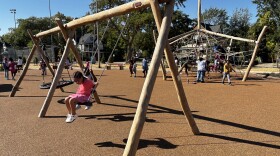 Children play on one of two playgrounds at the new Thurgood Marshall Green park and gathering space on Friday, October 3rd, 2025.