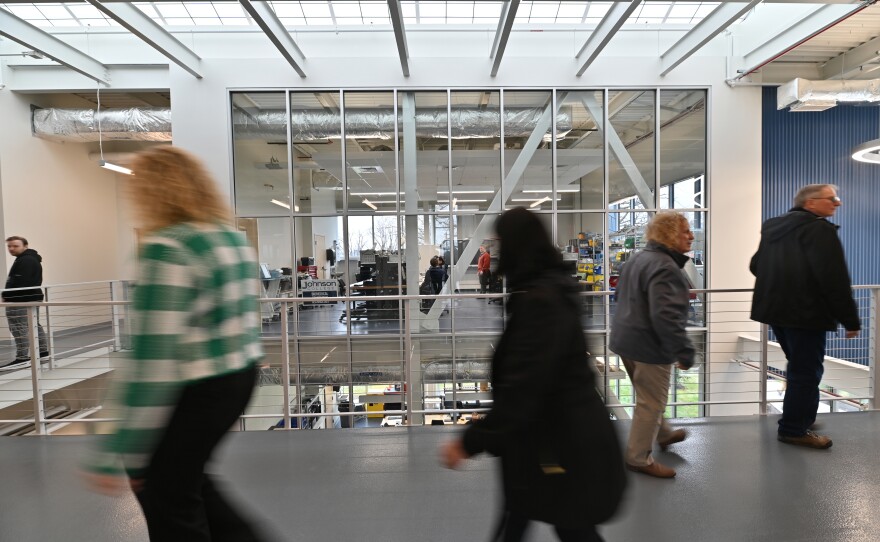 People tour the new Ideal Saldi Hall at Johnson College during the debut of the new building.