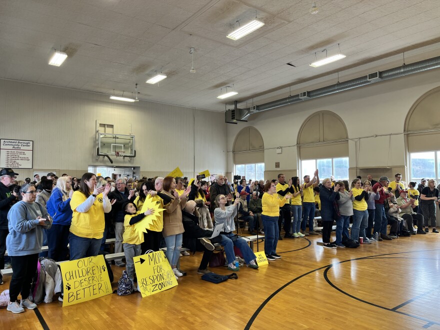 Archbald residents stand up and cheer after borough council denied a data center developers application to build on 400 acres.
