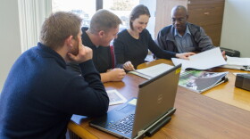 Members of the Oklahoma Department of Transportation’s engineer-in-training program look over plans for a proposed bridge December 21. ODOT submitted its budget reduction plan on time.
