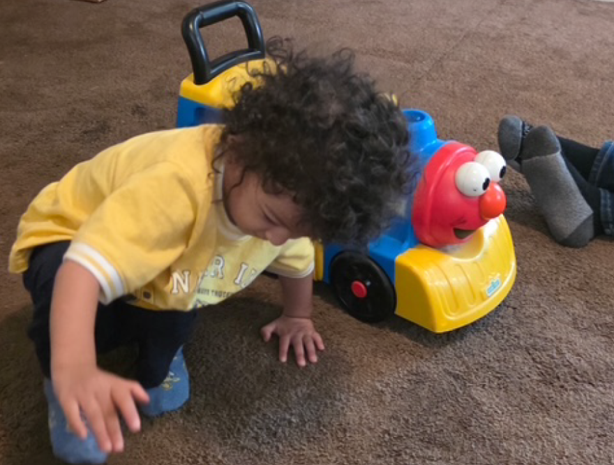 A child plays last week at his grandmother’s house where he now lives with his three siblings and four cousins, all who lost their parents in an ICE raid last month. The boy often stands by the door calling, “Mamá, mamá.”