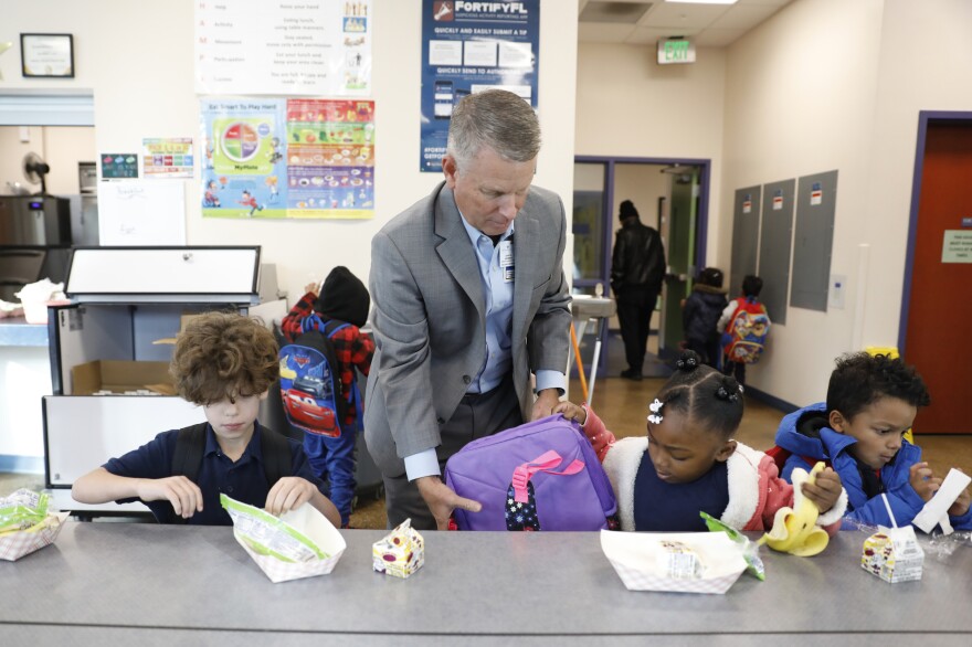 Principal Dave McMeen monitors students during breakfast. McMeen says mindfulness has played a role in turning the school around academically.