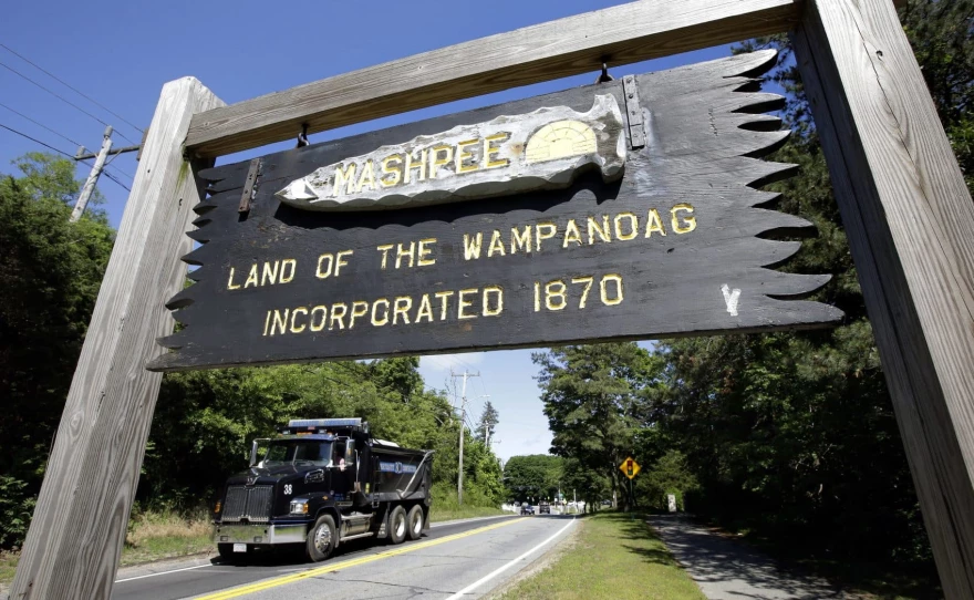 A wooden sign advises motorists of the location of Mashpee Wampanoag tribal lands in Mashpee, Massachusetts. 