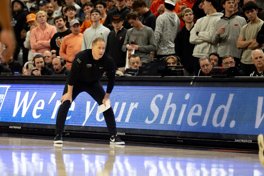 BYU head coach Kevin Young stands on the baseline in the first half of an NCAA college basketball game against Oklahoma State, Wednesday, Feb. 4, 2026, in Stillwater, Okla.