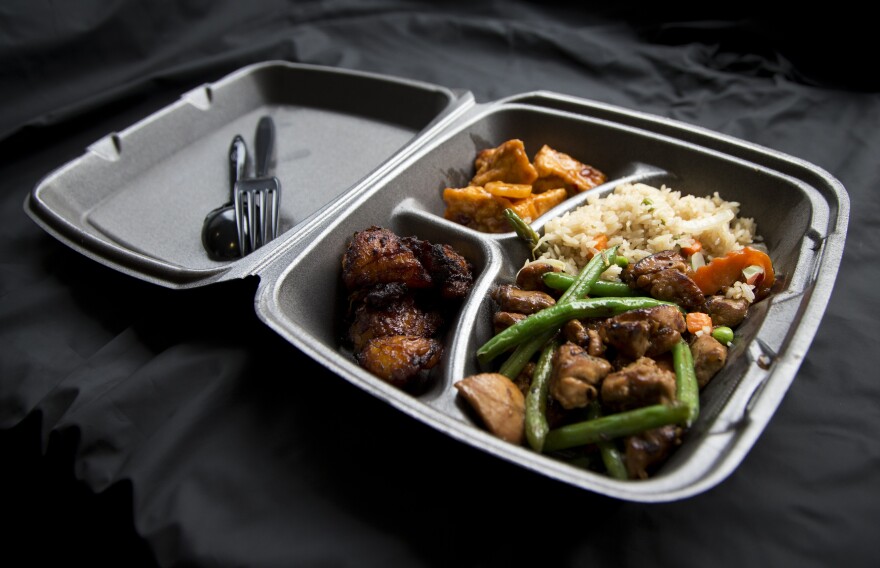 A styrofoam container is shown with take out food at a restaurant in Washington, Thursday, Dec. 31, 2015.