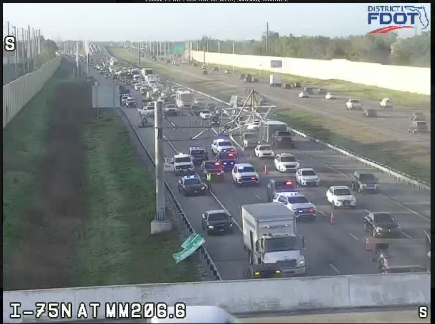 A truck on northbound I-75 at Proctor Road in Sarasota County hit a sign along the interstate early Monday morning and then struck and wedged under a bridge. Two lanes of I-75 northbound at the site were closed during removal efforts.