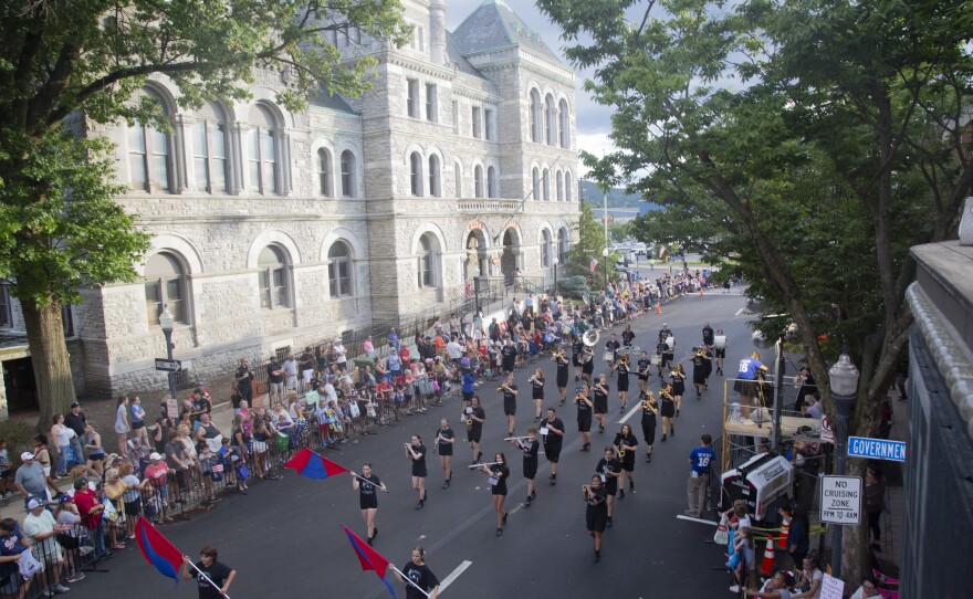 A marching band goes by the former Williamsport City Hall during the Little League World Series parade.