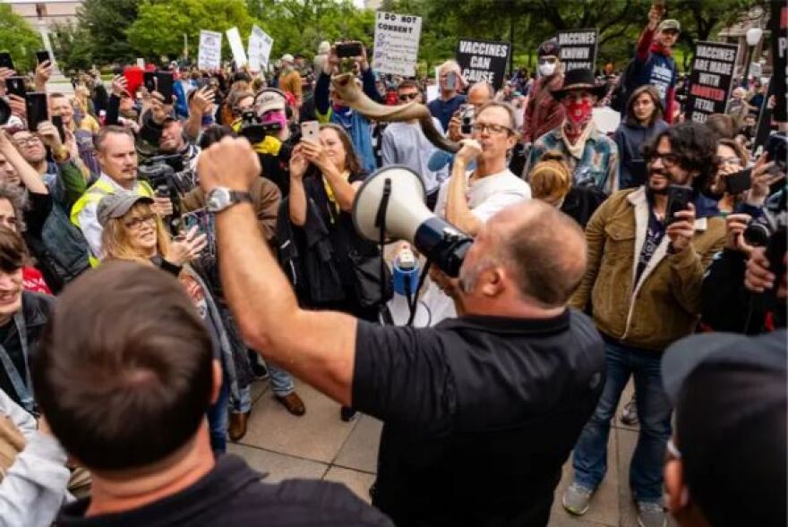 Jones speaks to a crowd gathered at the Texas Capitol in protest of economic shutdowns amid the coronavirus pandemic in April 2020.