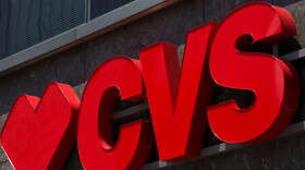 The CVS logo is seen outside a shop in Washington, DC, on July 9, 2019.