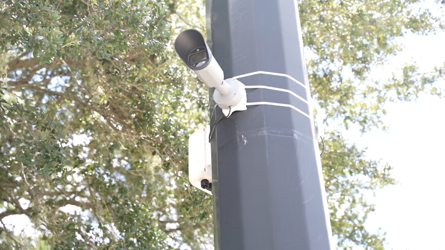 A camera sits on a pole in Gainesville.