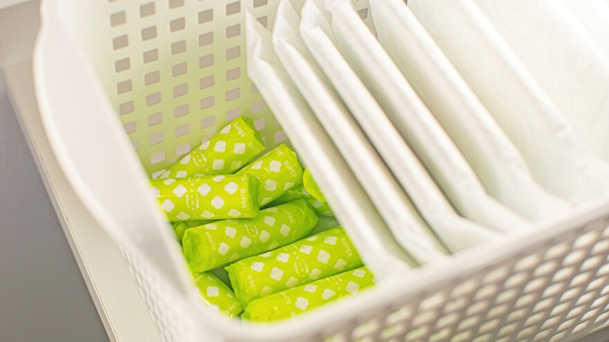 a while basket filled with tampons and pads