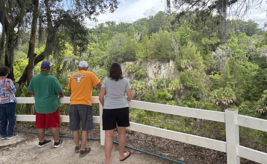 The Canyons Zip Line and Adventure Park in Ocala, Florida, offers a scenic escape from industrial reality. Here, a family looks on as they wait for their grandson to zip The Canyons. Taken Tuesday, June 9, 2026.