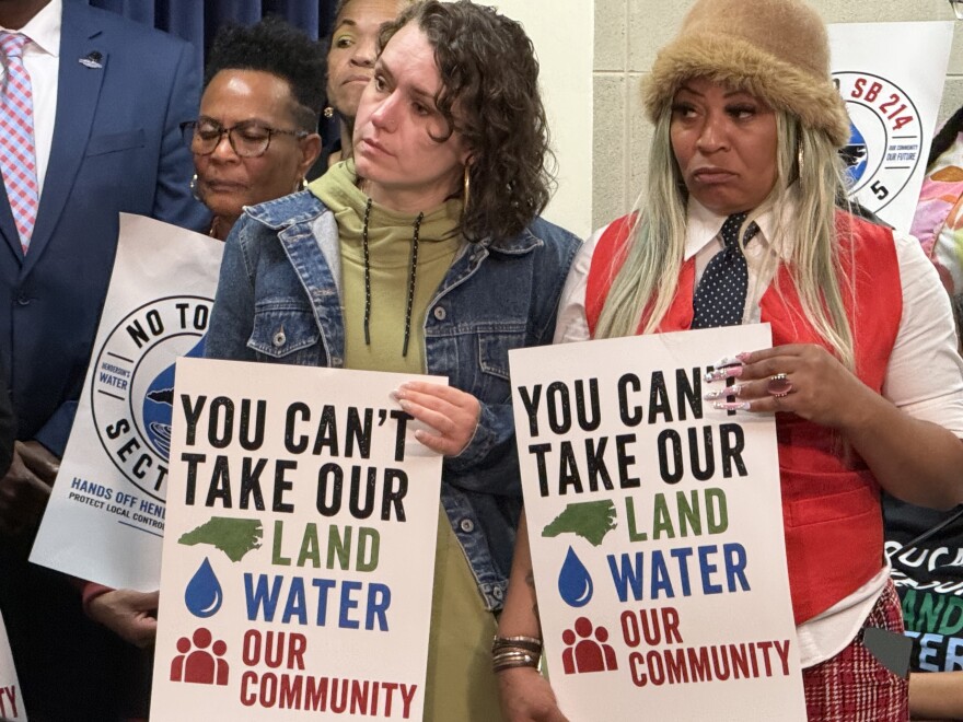 Opponents to a provision allowing Franklin County to buy or condemn land in three neighboring counties without permission from their boards look on during a press conference Tuesday, April 28. Offiicals from Henderson were particularly concerned about how the bill could impact the water plant, of which they own the largest proportion.