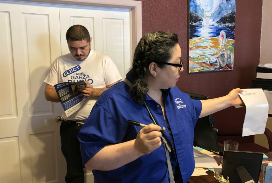 Teacher union members write down Janell Rubio's phone number to pass onto voters before handing out to campaign for the district 5 challenger Apr. 13.