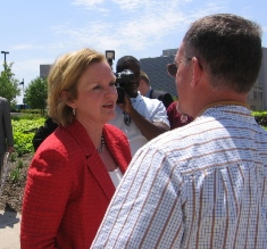 Democratic Senate candidate Claire McCaskill talks with a supporter after a press conference on immigration in Kansas City. McCaskill called for tougher penalties and stepping up enforcement against businesses hiring illegal workers.