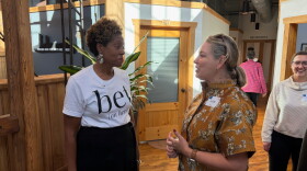 Rockstar Woman Movement founder Shannon Cohen (left) speaks with an event attendee.