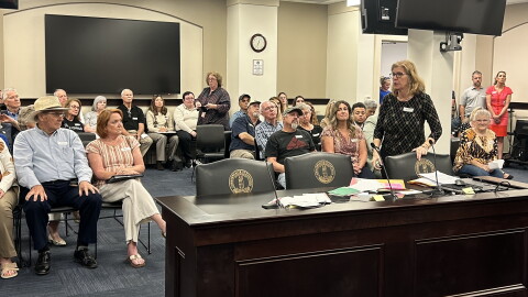 Janet Garrison from Mason County spills letters of support from people across the country who support their efforts to stop data center development in their rural community.