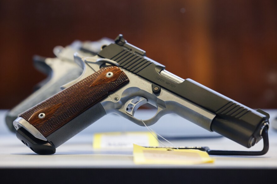 Hundreds of handguns and rifles are displayed for purchase at McBride’s Guns in Central Austin on April 20, 2021.
