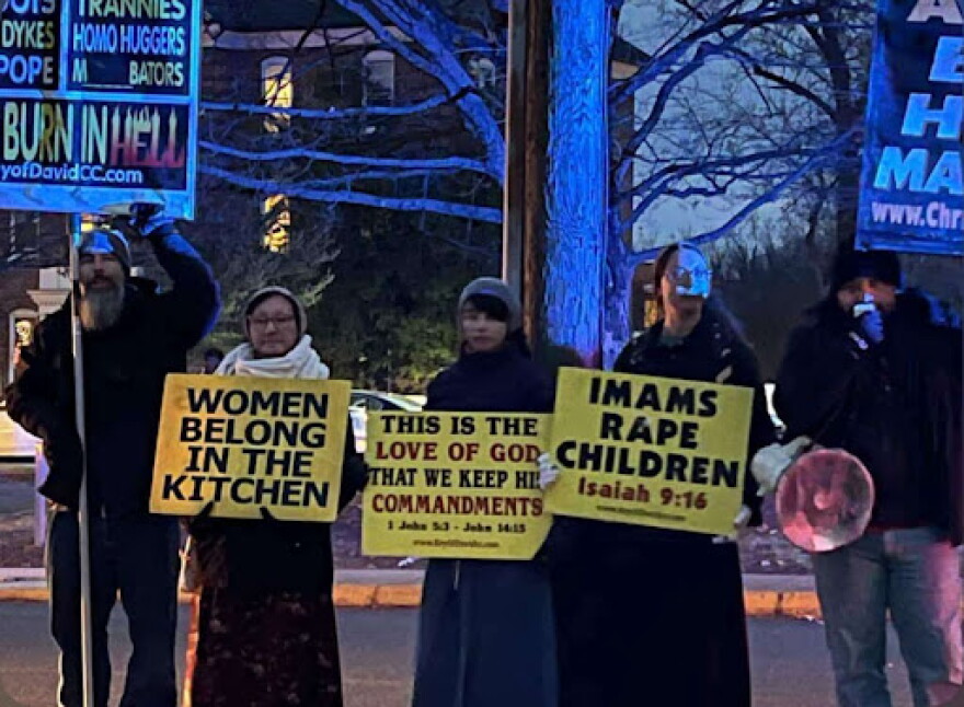 Demonstrators from the Key of David Church stand on the sidewalk outside Bridgewater's Memorial Hall last December.