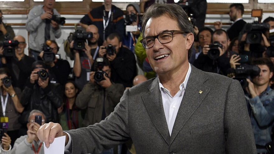 The president of Catalonia's regional government, Artur Mas, casts his ballot Sunday in a symbolic vote on whether to break away from Spain. Some 81 percent of voters opted for independence, but Spain says the vote was illegal and will not be recognized.