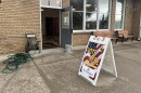 A sign directing people to go inside to vote.