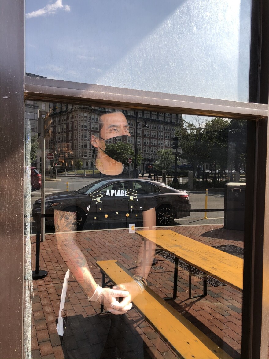 On Cornwall's first day open since the pandemic, business is slow, leaving server Miz Martinez long stretches of time to gaze out the window at the empty streets, in the once-bustling Kenmore Square.