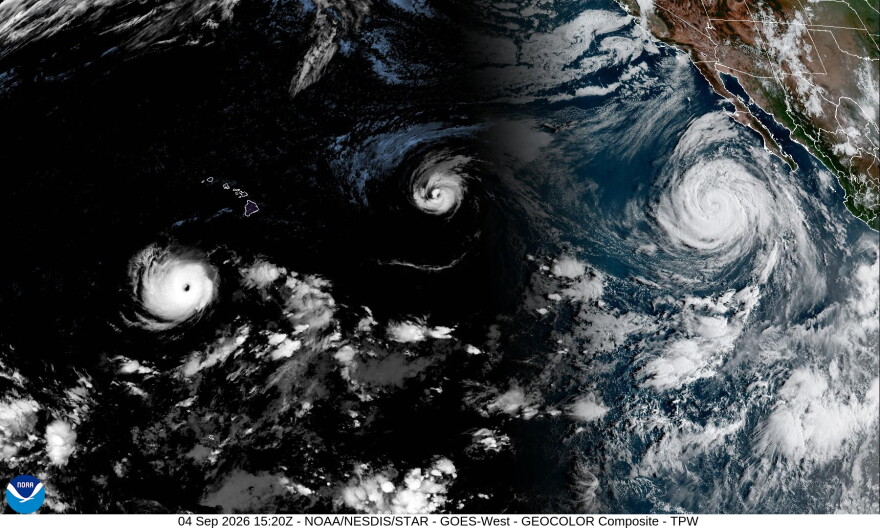 A satellite image shows from left to right, Hurricane Lowell, Hurricane Karina and Hurricane Marie on Friday morning.