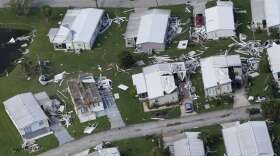 Homes that sustained wind damage caused by Hurricane Ian are seen in this aerial view, Thursday, Sept. 29, 2022, in Fort Myers, Fla. (AP Photo/Marta Lavandier)