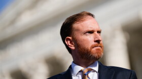 West Virginia Attorney General John McCuskey stands outside the Supreme Court after oral arguments, Jan. 13, 2026, in Washington.