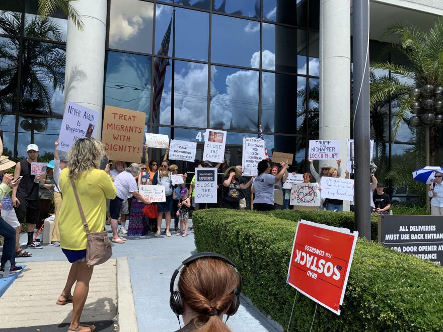 Protesters lined up in front of U.S. Rep Kathy Castor's office on Tuesday for a "Close the Camps" rally, aimed at shutting down immigration detention centers earlier this year.. 