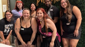 Sarah Chojnacki (left front) and Ashley Mertes (right front) pose with a group of friends and volunteers at the first Fat Body Hotties clothing swap hosted at Sherman Phoenix on Aug. 02, 2025.