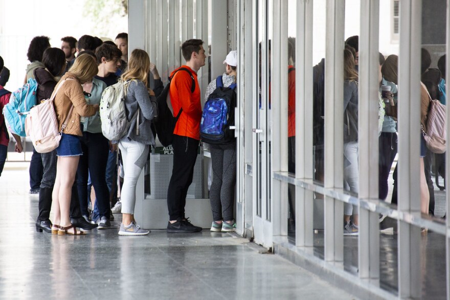 Voters line up to cast ballots on the UT Austin campus last year.  