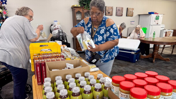Linda Rufus selects food from the Food Bank of Iowa at an apartment complex in Storm Lake, Iowa, on Thursday, July 16, 2026. Rufus said the pop-up pantry at Storm Lake Senior Living helps her make ends meet.