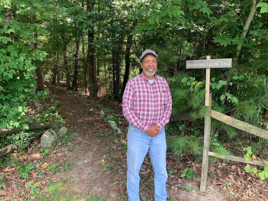  Jeff Palmer stands at one of the trail access points. 
