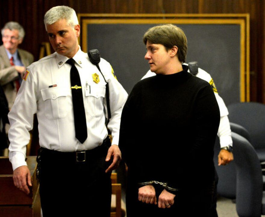 Sonja Farak is led from Hampshire Superior Court in 2014 after pleading guilty and getting sentenced to charges of tampering with drug evidence while she worked at the state lab in Amherst.