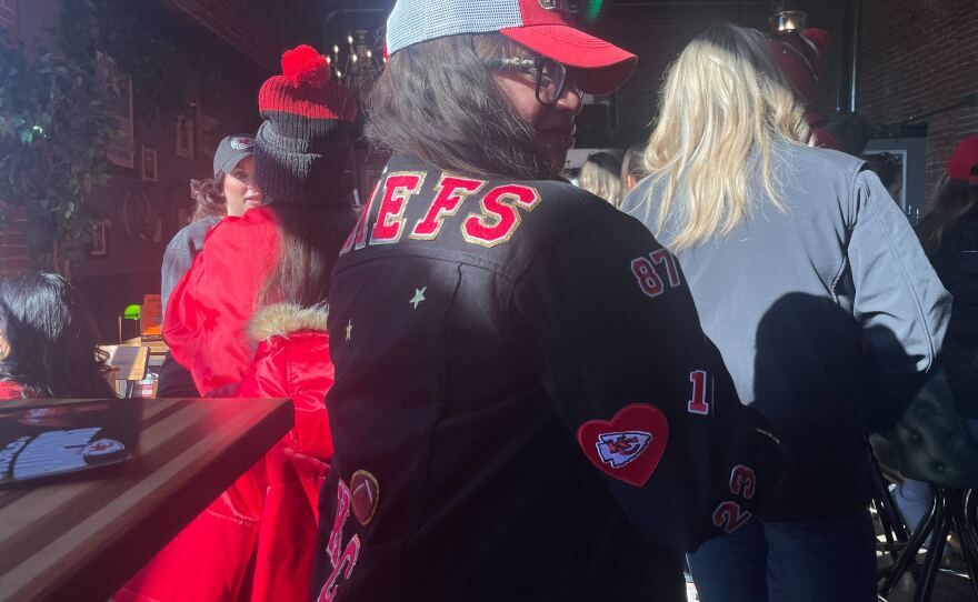 Diana Reyes, at Afterword Tavern and Shelves, in a custom jacket made by her crafty husband, who she will meet up with tonight for Valentine's Day dinner.