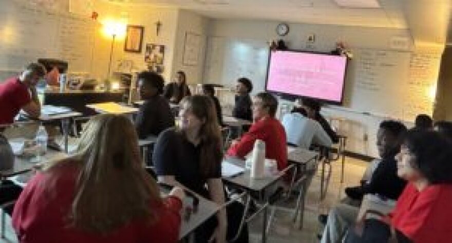 Students at Cardinal Ritter High School take a break from a theology lesson to meet Gov. Mike Braun on Aug. 20, 2026.