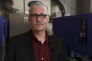 A man looks at the camera