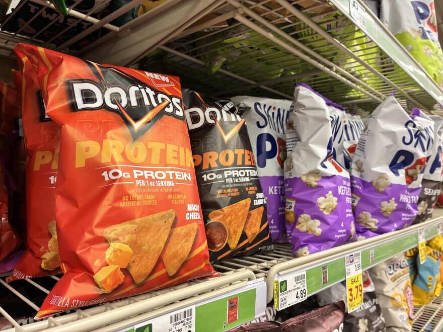 Bags of protein snacks line the grocery store aisles. The protein added is casein, a milk protein that comes from dairy farms.