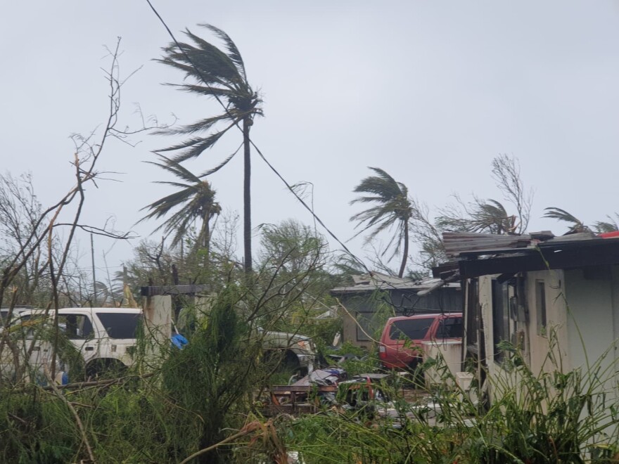 Debris covers the ground in Saipan on Wednesday, April 15, 2026, as a super typhoon with ferocious winds and relentless rains, shredded tin roofs and forced residents to take cover from flying tree limbs.