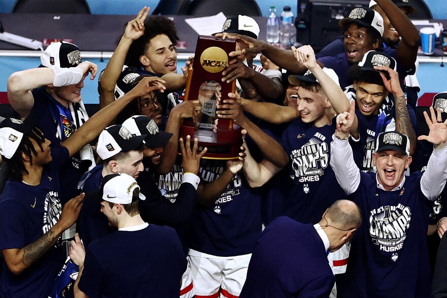 Connecticut Huskies celebrate after defeating the Purdue Boilermakers in the NCAA Men's Basketball Tournament National Championship game at State Farm Stadium on April 08, 2024 in Glendale, Arizona.