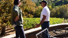 Oregon Department of Agriculture Director Alexis Taylor speaks with Rogue Valley Winegrowers president John Pratt about smoke taint's effects on wine grape crops.