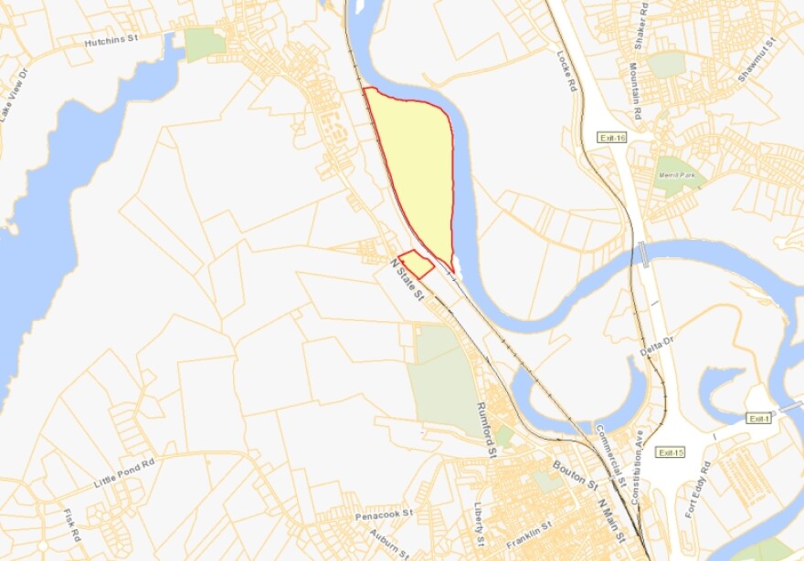 The highlighted parcel, owned by the state of New Hampshire, runs along the Merrimack River across North State Street from the state prison complex.