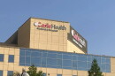 A medical building that says "Carle Health Methodist Hospital"