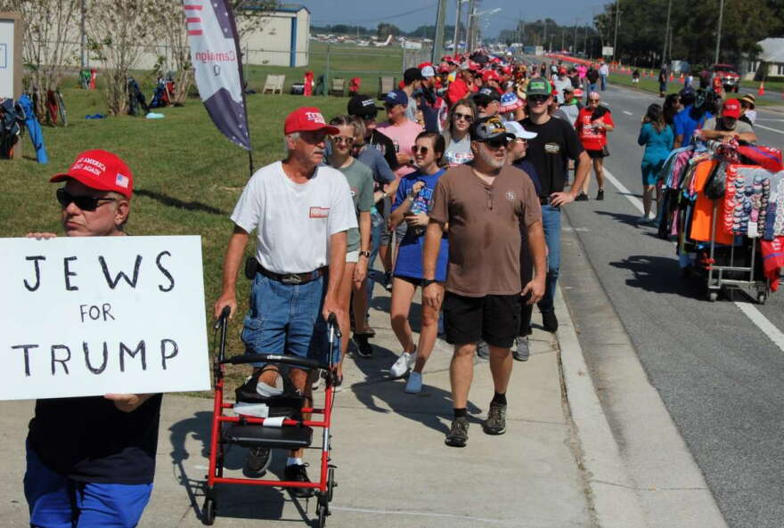 Even a few a hours ahead of time, a long line of Trump supporters waited to get into the campaign rally at the Ocala International Airport in Ocala on Friday. Photo: Joe Byrnes