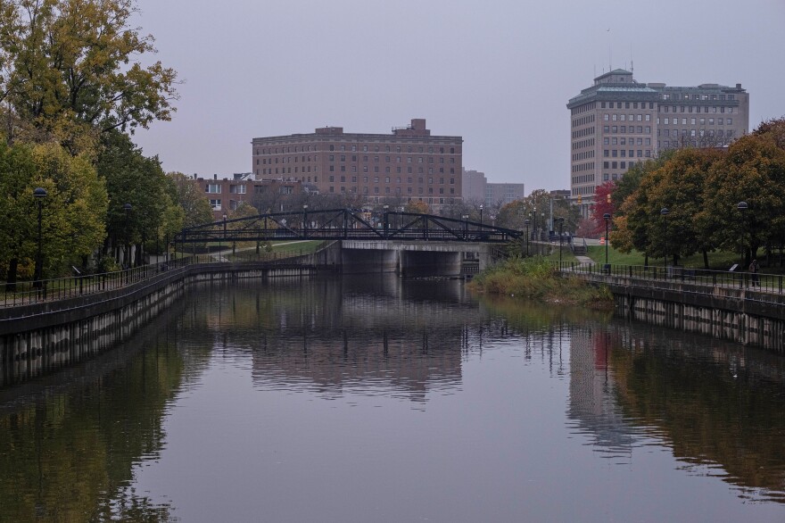 The Flint River flows past downtown Flint, Mich., in 2020. Many city residents still don't fully trust the safety of their tap water.