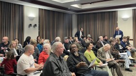 People sit in nearly every chair in Hamilton's City Council Chambers.