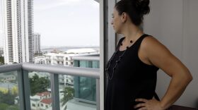 In this Wednesday, Aug. 3, 2016 photo, Jessica Ardente poses for a photograph in her apartment in Miami. Ardente is four months pregnant and lives within the one-square mile radius where the Zika virus has been detected. The CDC has advised pregnant women to avoid travel to the Miami neighborhood of Wynwood where mosquitoes are apparently transmitting Zika directly to humans. (AP Photo/Lynne Sladky)