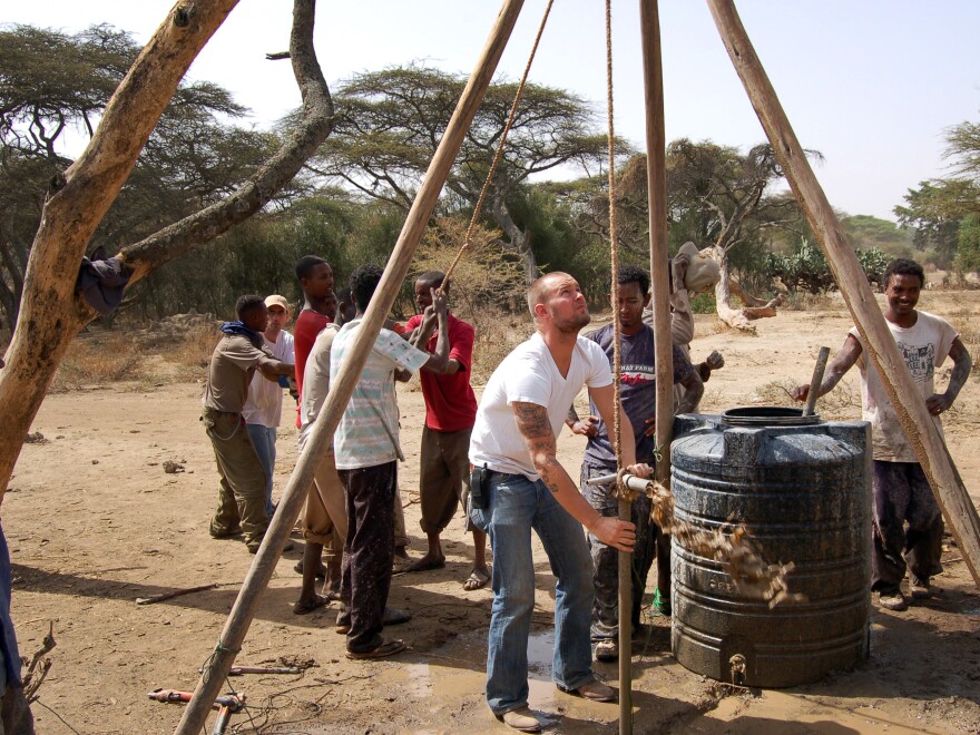 The Water to Wine Machine hoax was designed to bring attention to Wine to Water, an international water charity. The group's president, Doc Hendley, is pictured above, center, in Ethiopia.