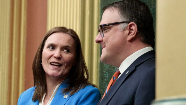 Senate Majority Leader Winnie Brinks, D-Grand Rapids, and House Speaker Matt Hall, R-Richland Township, were on hand for Gov. Gretchen Whitmer’s 2025 State of the State Address. (Photo: Simon Schuster/Bridge Michigan)